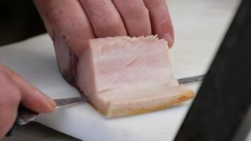 Slicing Cooked fish with a Knife on a Cutting Board video