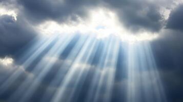 Divine Light Rays piercing through dramatic clouds creating a celestial spectacle photo