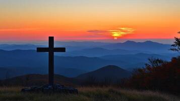 Mountain Cross at Sunset Faith Hope and Natures Beauty Converge in a Serene Landscape photo