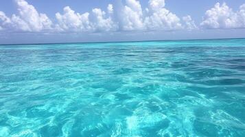 Crystal Water Serenity Turquoise Sea Under a Cloudy Blue Sky Waves Gently Ripple photo