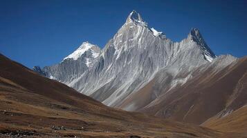 Snowcapped Peak A Majestic Mountain Scene Under a Brilliant Sky photo