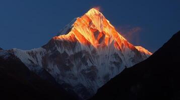 Sunrise Spectacle Majestic Peak Bathed in Golden Light Amidst Stark Blue Sky photo