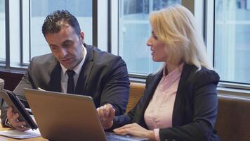 Dynamic business duo collaborating on an exciting new project video