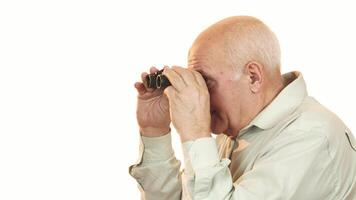 Joyful grandfather beaming at the camera after peering through binoculars video
