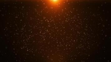 Abstract golden particles animation concept for birthday and holiday celebration. Bokeh effect background 4k loop with light particles and stars on dark background. Rain of beautiful glitter dots. video