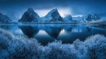 Arctic Majesty Reflecting SnowCapped Mountains in Still Waters on a Cold Winters Day photo