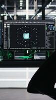 Vertical Monitors in data center displaying node tree programming optimizing infrastructure health. Visual programming systems on workstations detecting server room equipment malfunctions, jib up shot video