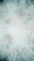 Earthy green and brown particle background. Gently swirling particles abstract vertical background. video