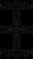 Minimalist black and white kaleidoscopic pattern background. Intricate line art design. This elegant ornate vertical animation is full HD and a seamless loop. video