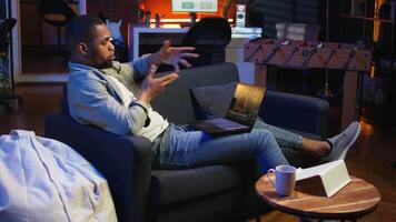 Freelancer joining a teleconference call for remote workshop lesson, maintaining a strong digital connection for effective online course. Man engaging in discussion via virtual chat. Camera A. video