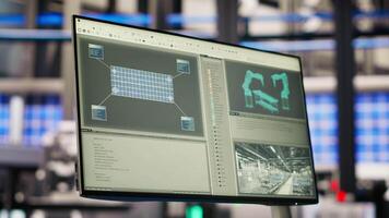 Monitor in smart photovoltaics factory analyzing performance data to optimize operations. Display in industry 4.0 solar panels plant conducting preventive maintenance for equipment through IoT sensors video