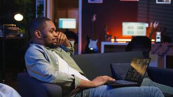 Smiling african american man hosting a virtual family meeting online via conference, meeting with the relatives and sharing latest news. Guy uses web connection to chat. Camera A. video