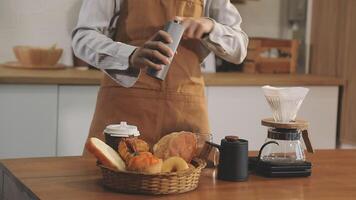 A person in an apron is preparing breakfast video