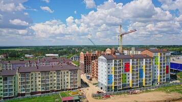 Building of a modern district. Construction site of new complex with high rise buildings. Colorful apartment building in new microdistrict. video