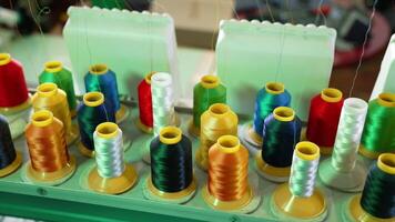 Collection of colorful spools for a dressmaker. Sewing tools for handicraft job. Spools of thread of different colors for tailor. video