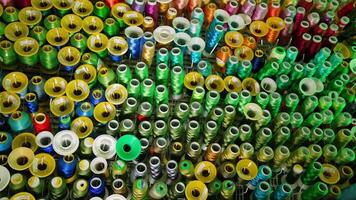 Colorful sewing threads background. Many spools of thread of different colors. Sewing tools. Hobbies and handicrafts. video