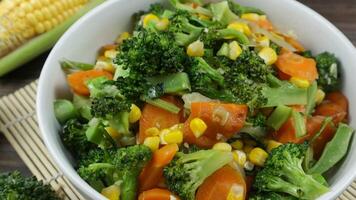 Close up, Mix of vegetables on white bowl. Healthy asian food concept with copy space photo