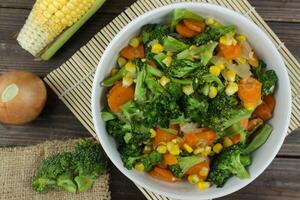 Top view Mix of vegetables on white bowl. Healthy asian food concept with copy space photo