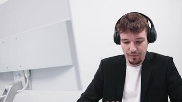 Technical support operator working with a headset in the office, speaking with a customer. Concept high-quality customer assistance, efficient problem-solving video