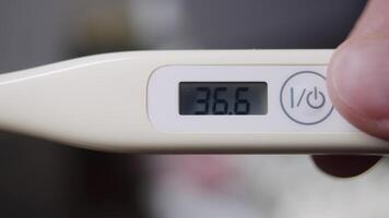 Close-up of an electronic thermometer display, showing normal values for healthy human body temperature, in numerical form. video
