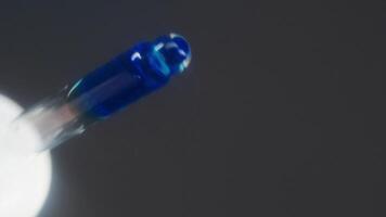 Bright blue medicine is used to restore vision. It is applied directly to eyes using pipette. Due to this medication, image temporarily becomes blurry, making it difficult to see clearly. POV video
