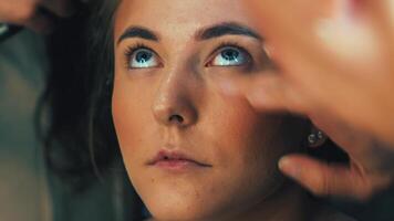 A close-up shows foundation application. Skin tone becomes smooth and even video