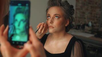 She brushes her eyebrows into shape. Small details create a polished and expressive look video
