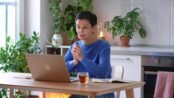 Confident woman enthusiastically gesture while discussing tasks on call from home, engage team video
