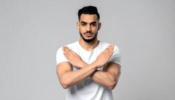 Man with crossed arms making a stop gesture photo