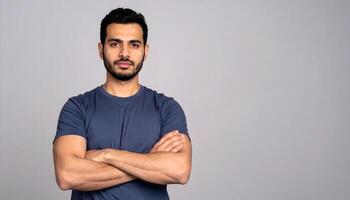 Portrait of a confident man with arms crossed and a serious expression photo
