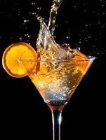 Refreshing cocktail splash captured in motion with vibrant citrus garnish photo