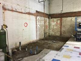 A Retail Store Having a Big Remodel with the Floor Dug Up and Walls Torn Down photo