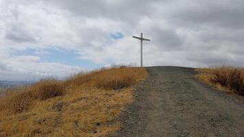Menifee Cross Trail, Wide Hiking Trail to the Top of a Hill with a Large Cross photo