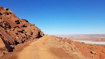 Off-road 4x4 Driving on Gemini Bridges Road Near Edge of a Cliff, Moab, Utah photo