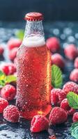 Cold raspberry beer and fresh raspberries on dark stone background. Summer beverage concept with empty space photo