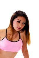 Attractive Asian American Woman In Pink Top On White Background photo