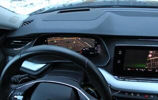 Local Street Map And Car Position Displayed On Central Part Of Car Dashboard With Activated Navigation photo