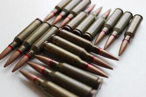 Angle View Of Real Bullets Caliber 5.45 Laid Out In Square Order Isolated On White photo