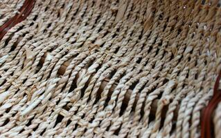 Technique of hand weaving products from twigs in the form of a braid photo