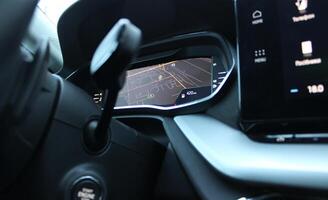 Bottom view from under the steering wheel of GPS map is displayed on the car dashboard photo