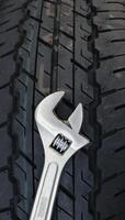 Adjustable Wrench For Wheel Mounting On A Car Tire Surface photo
