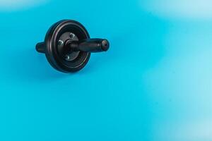 Weightlifting equipment on a vibrant blue background photo