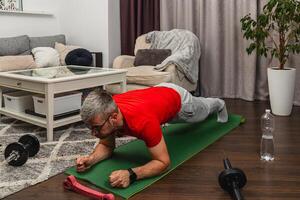 Man doing plank exercise in modern living room setup photo
