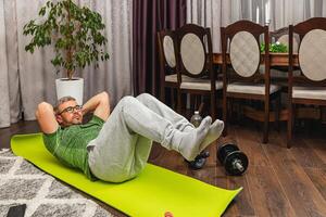 Fitness routine at home while using exercise mat photo