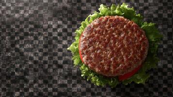 A hamburger is shown on a checkered table photo