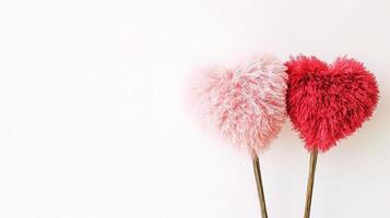 Two fluffy hearts on a wooden stick photo