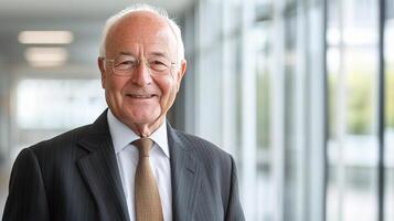 An older man in a suit and tie smiling photo