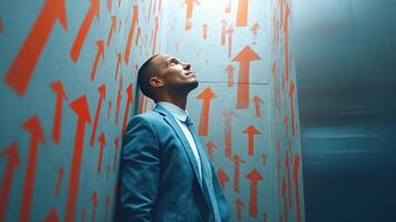 A man in a suit standing in front of arrows photo