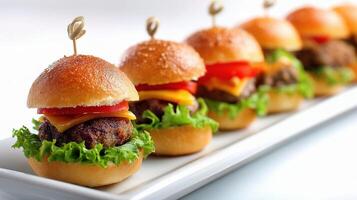 Mini sliders with cheese, lettuce, tomato and pickles photo