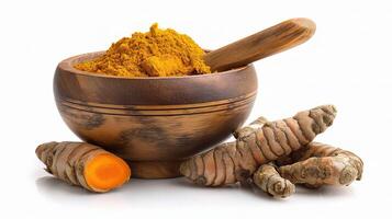 Tumeric and turmeric powder in a wooden bowl photo
